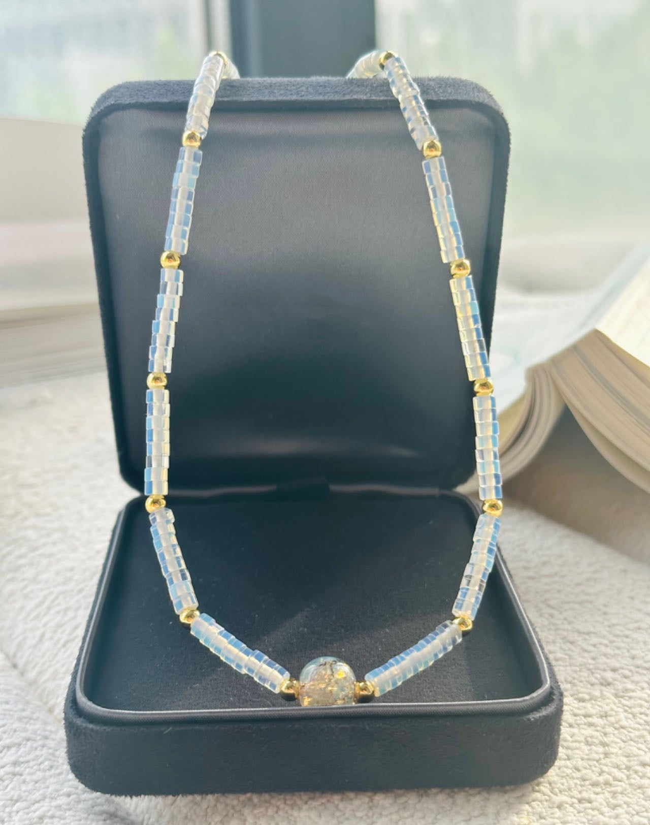 Elegant Light Blue Crystal Wheel Necklace with Gold and Gradated Crystal Beads