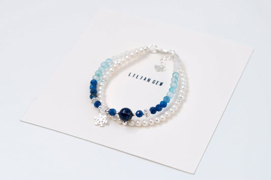 Product Description: Frozen-Inspired Blue &amp; White Crystal Bracelet – Icy Elegance